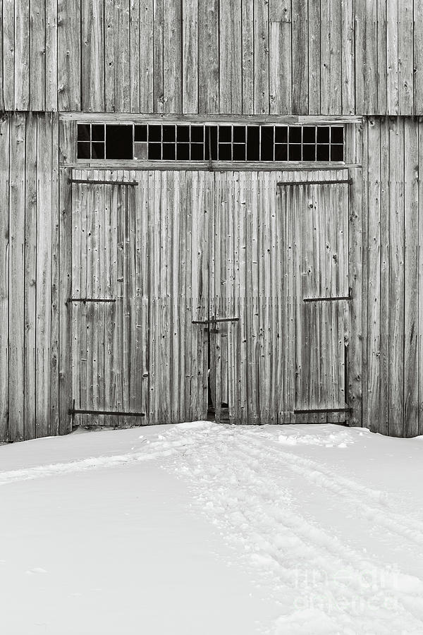 Old Wooden Barn Doors in the Snow Photograph by Edward Fielding