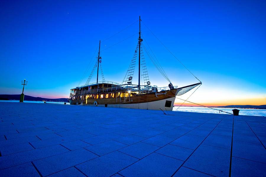 Old wooden sailboat at blue evening Photograph by Brch Photography
