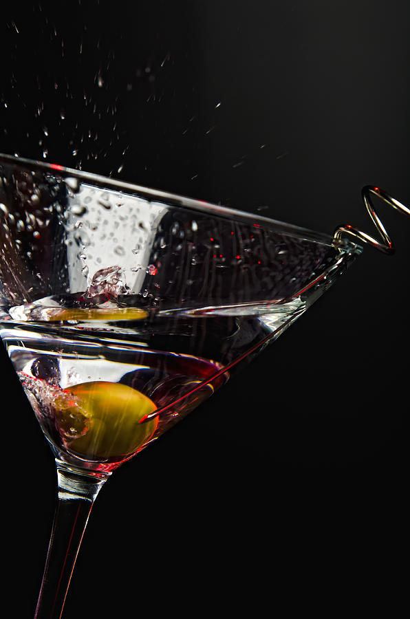Martini Photograph - Olive splashing into cocktail glass by Andre Babiak