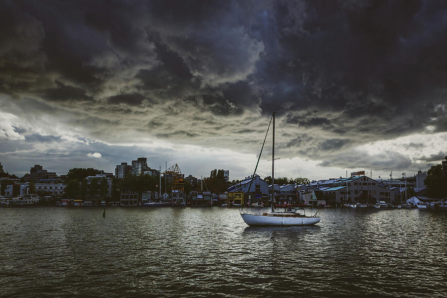Ominous Clouds Over Isolated Boat Photograph by Andy Konieczny