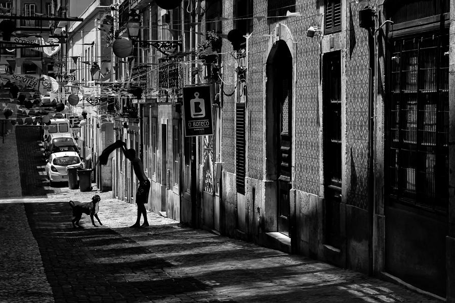 Black And White Photograph - One Man and His Dog. Bairro Alto. Lisbon by Carol Japp
