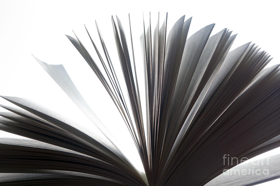 Open book with pages fluttering Photograph by Michal Bednarek
