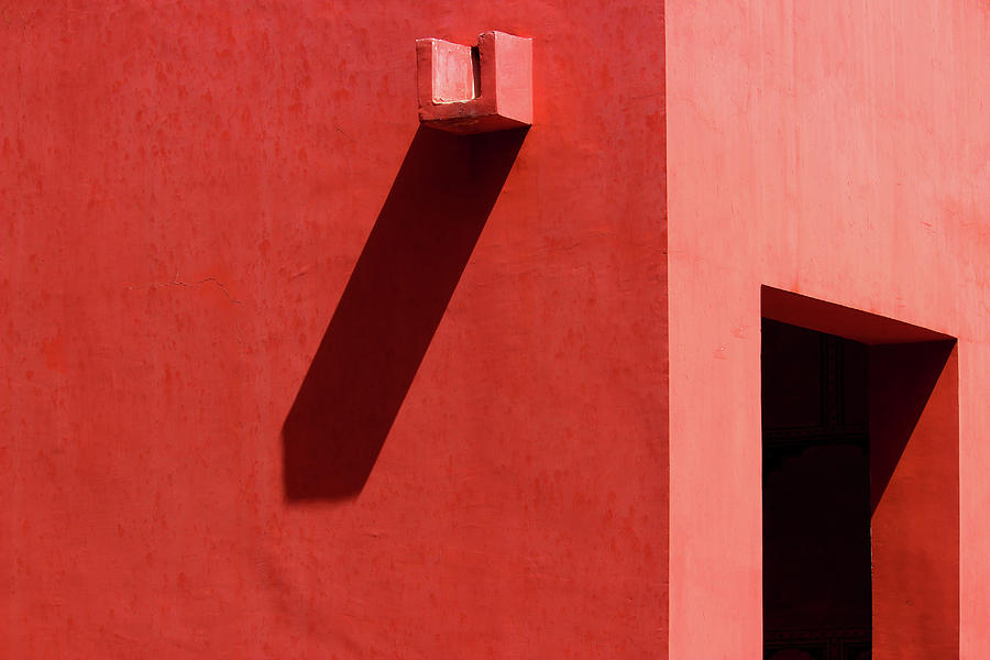 Open Door and Water Outlet on a red wall Photograph by Prakash Ghai