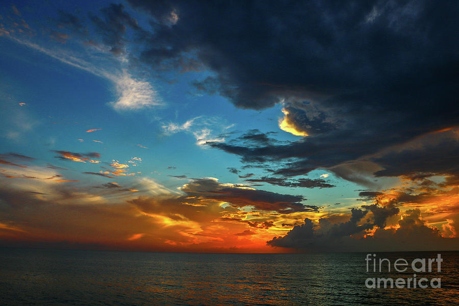 Orange and Blue Cloudy Sky Photograph by Tom Claud