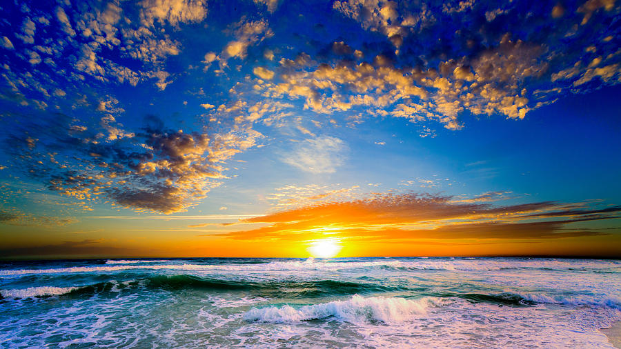 Ocean Sunset Photograph - Orange And Blue Sunset Sun Setting Over The Ocean by Eszra Tanner