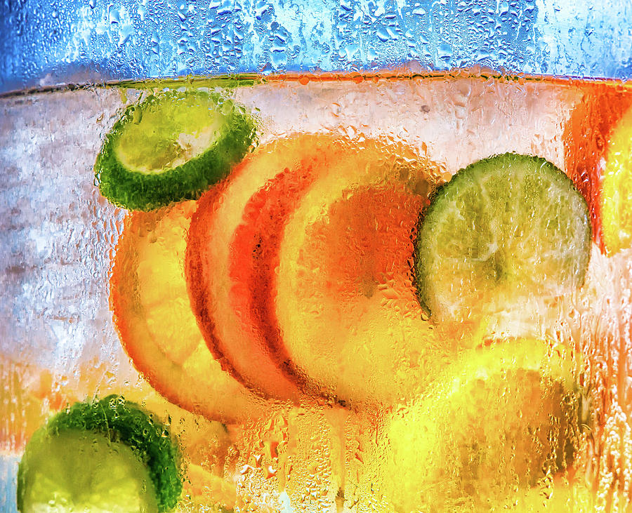 Orange and Lime Slices in Water Photograph by Darryl Brooks
