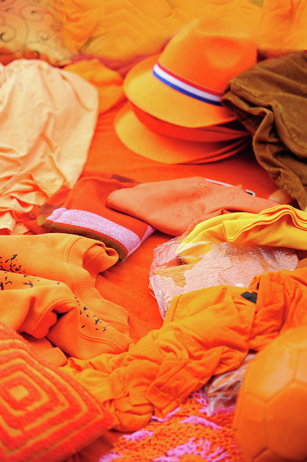 Orange Clothing Display at Amsterdam Market Photograph by Jenny Rainbow