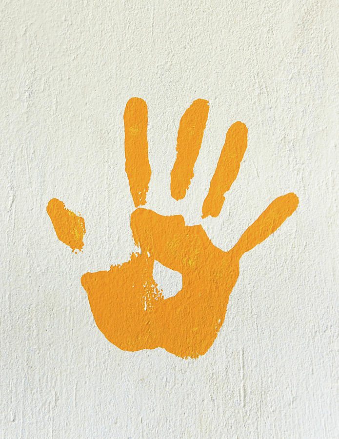 Orange handprint on a wall Photograph by Dutourdumonde Photography