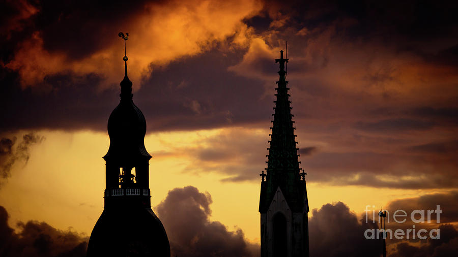 Orange sunset view in old town Riga Artmif Photograph by Raimond Klavins