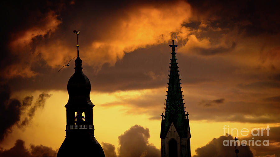 Orange sunset view in old town Riga Photograph by Raimond Klavins