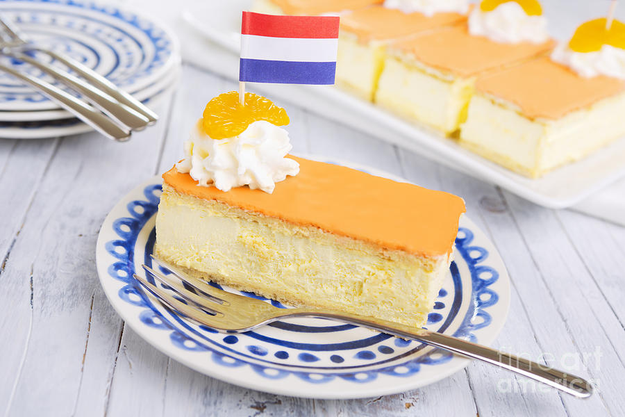 Cake Photograph - Orange tompouce, traditional Dutch pastry, on a rustic table by Sara Winter