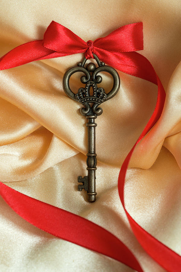Ornamented key with red ribbon and red bow Photograph by Jaroslaw Blaminsky