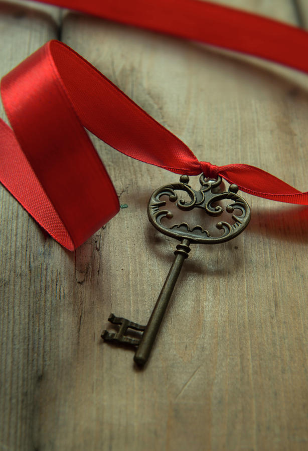 Ornamented key wth red ribbon Photograph by Jaroslaw Blaminsky