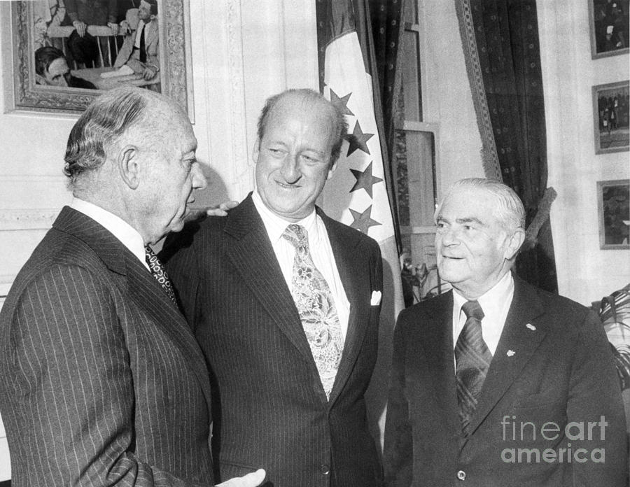 Osborn Elliott Confers With Friends. 1976. Photograph by Anthony ...