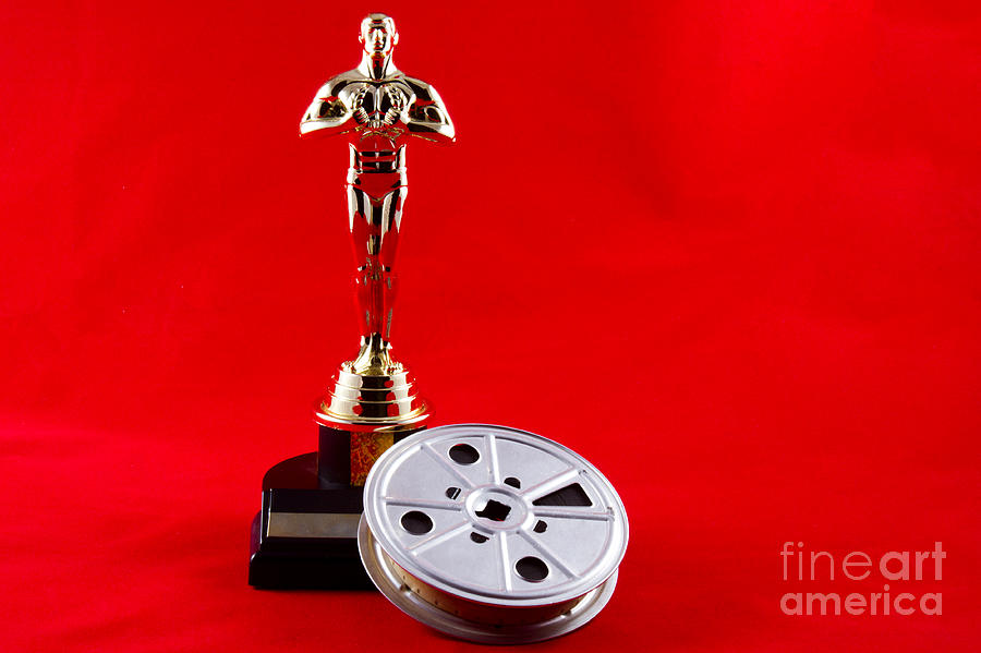 Oscar Statuette with Movie Reel Photograph by Karen Foley