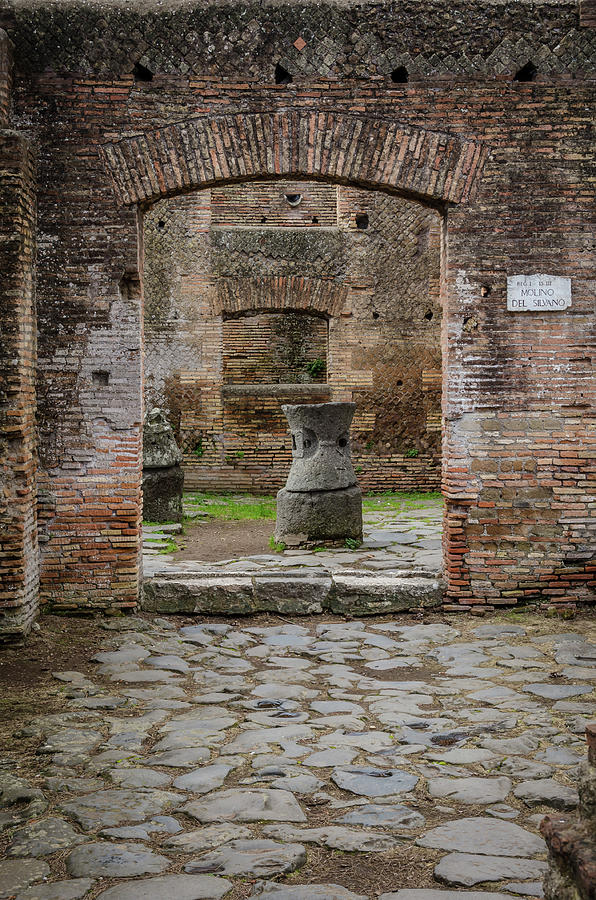 Ostia Antica - Millstones Photograph by Debra Martz