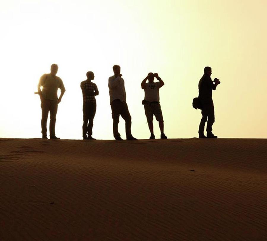 Sunset Photograph - Our Expedition Team On The Sand Dunes by Zsolt Repasy