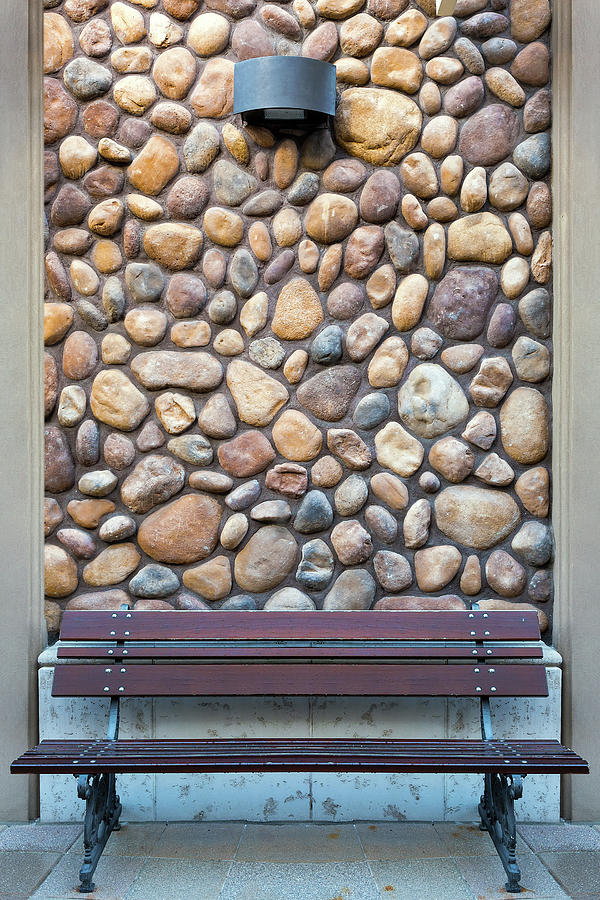 Outdoor Wood Bench by Rock Wall Photograph by David Gn