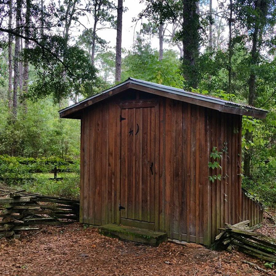 Gainesville Photograph - Outhouse At The Living History Farm In by Karen Breeze