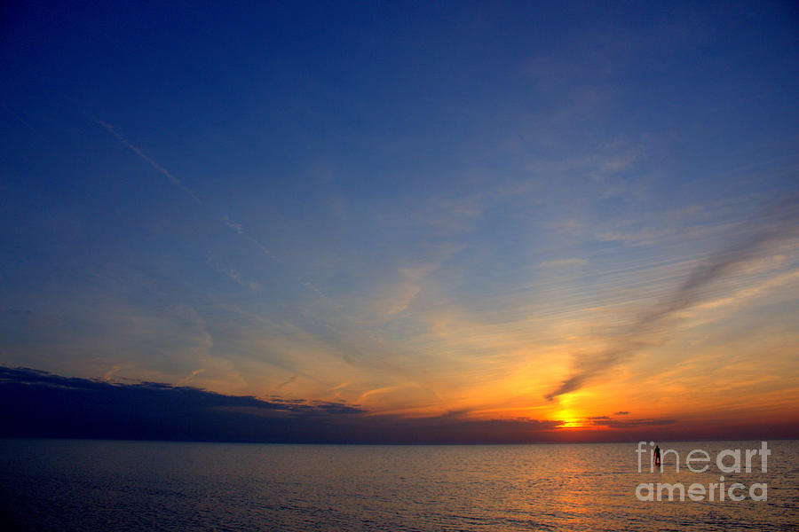 Paddling In To The Sunset Photograph by John Scatcherd - Fine Art America