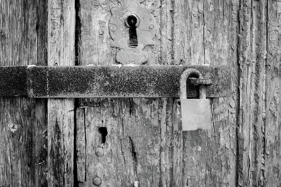 Padlock On An Old Wooden Door Photograph by Marco Oliveira