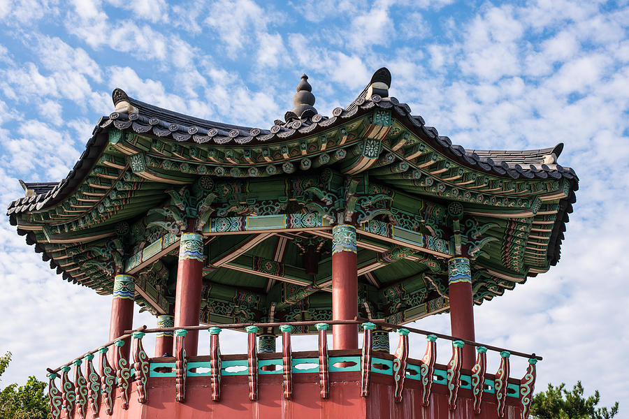 Pagoda against a mottled blue sky Photograph by Kabayanmark Images ...