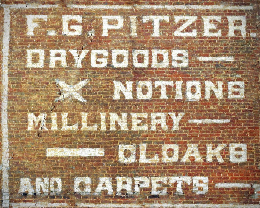 Brick Wall painted store sign Photograph by Denise Beverly