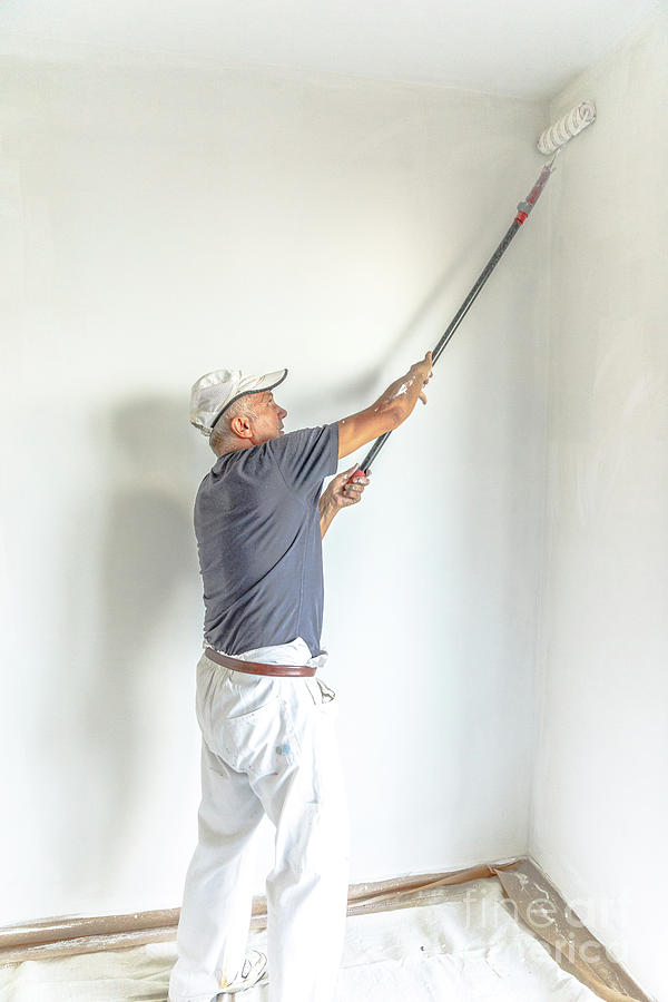 Painting white wall Photograph by Benny Marty