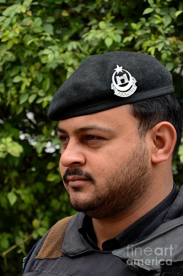 Pakistani police officer with black beret and insignia Peshawar Pakistan Photograph by Imran Ahmed