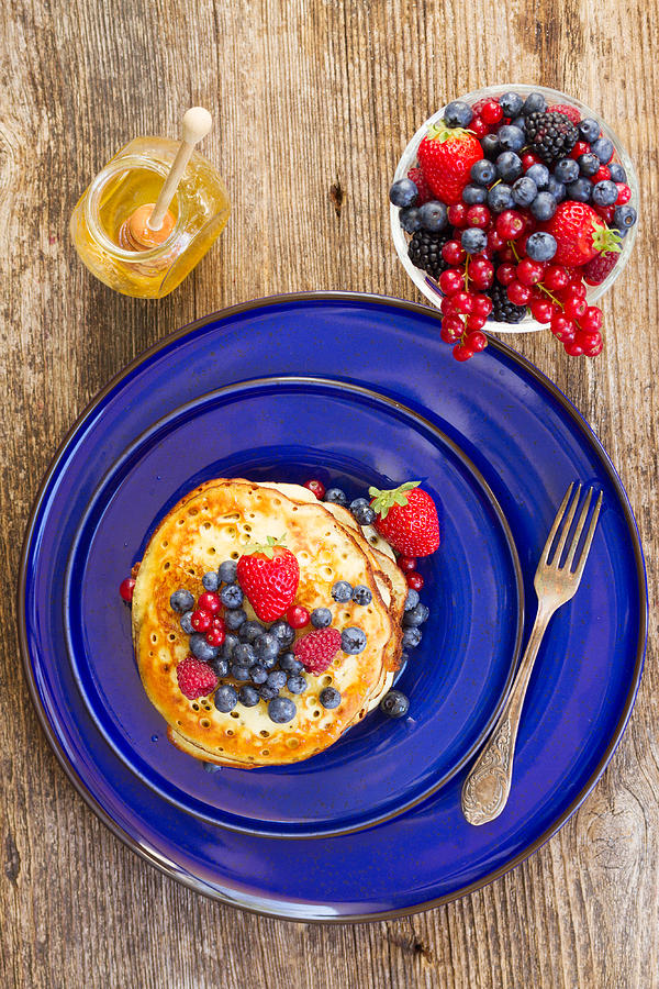 Pancakes with Berries on Blue Photograph by Anastasy Yarmolovich