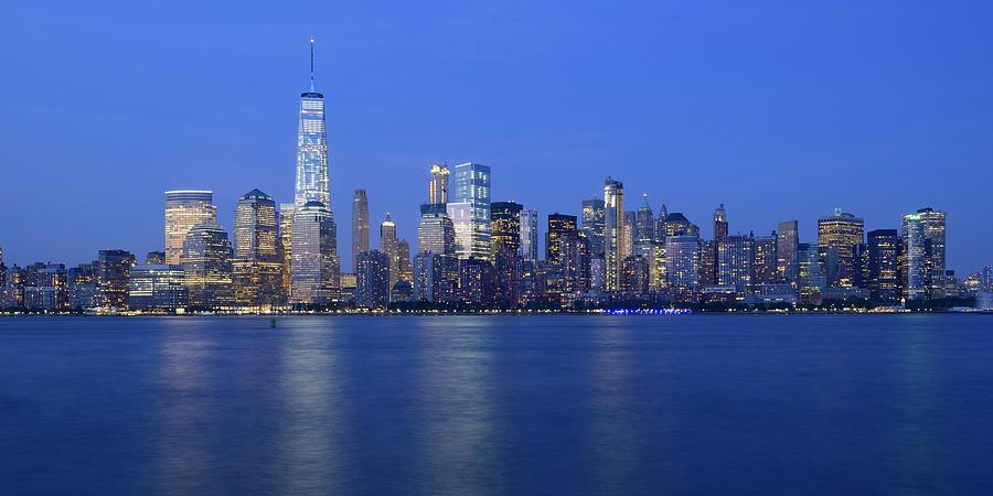 Panorama Manhattan skyline in the evening with One World Trade Center Photograph by Merijn Van der Vliet