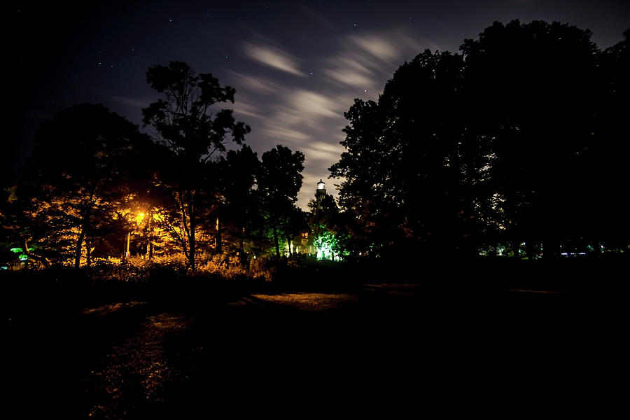 Park and Lighthouse at night Photograph by Sven Brogren