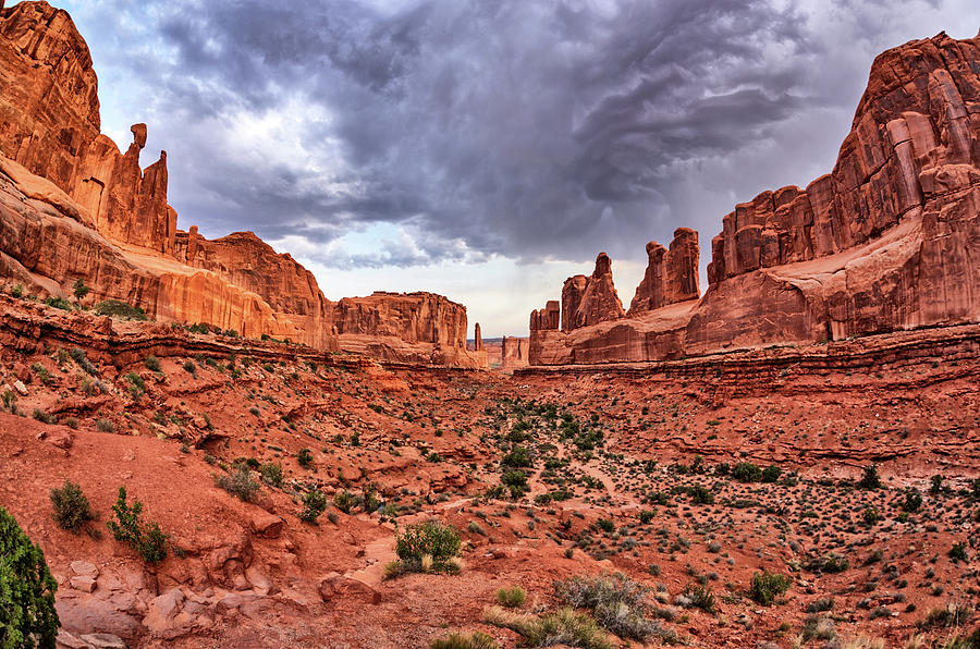 Park Avenue with Storm Clouds - Arches NP Photograph by Kyle Lee