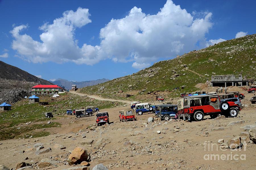 Parked willys jeeps in mountains around Lake Saiful Muluk North Pakistan Photograph by Imran Ahmed