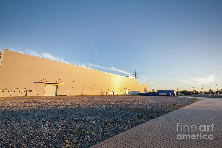Parking area outside big warehouse. Urban, industrial Photograph by Michal Bednarek