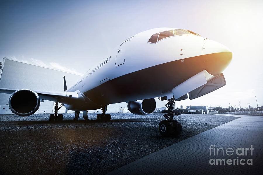 Passenger airplane on the airport parking Photograph by Michal Bednarek