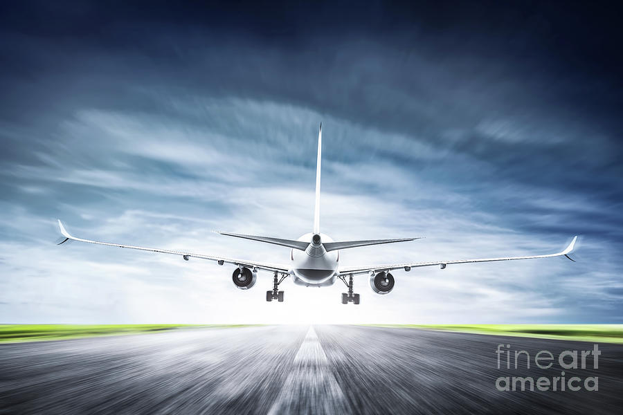 Passenger airplane taking off on runway Photograph by Michal Bednarek