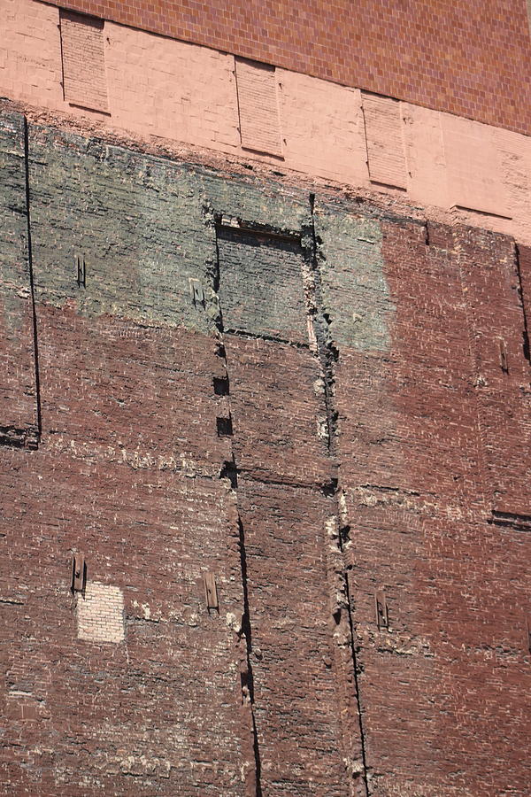 Patchwork Pattern on Brick Building Photograph by Colleen Cornelius