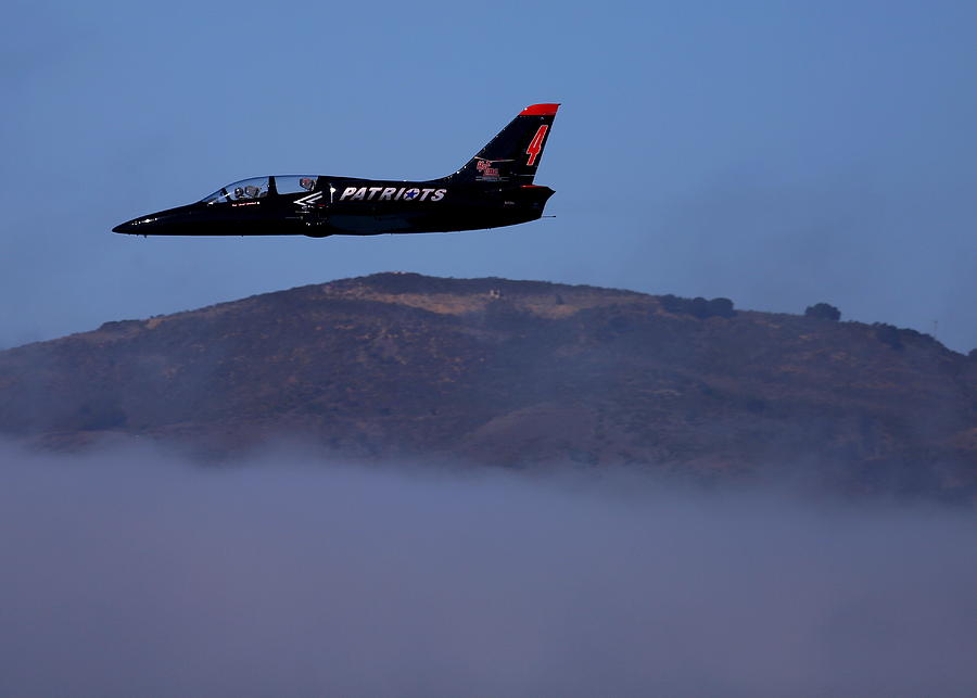 Patriot Jet Skims the Fog Over San Francisco Bay Photograph by John King