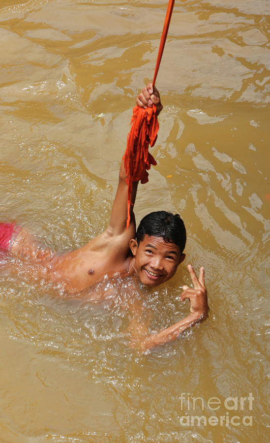 Landscape Photograph - Peace sign Cambodian Boy in Siem Reap River  by Chuck Kuhn