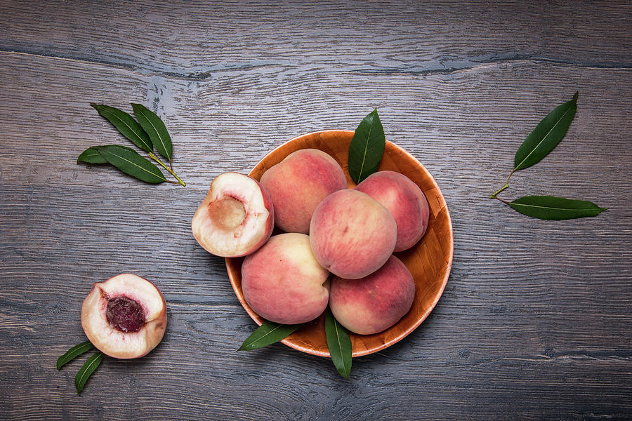 Peaches On A Dark Wooden Background Photograph