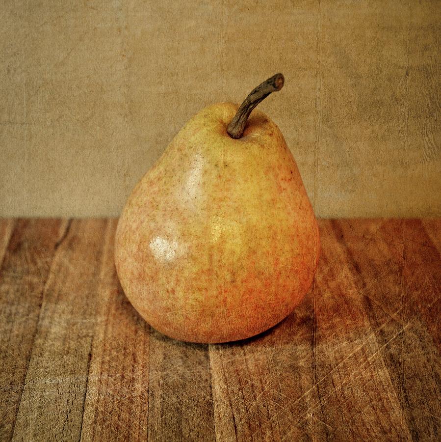 Pear on Cutting Board 3.0 Photograph by Michelle Calkins