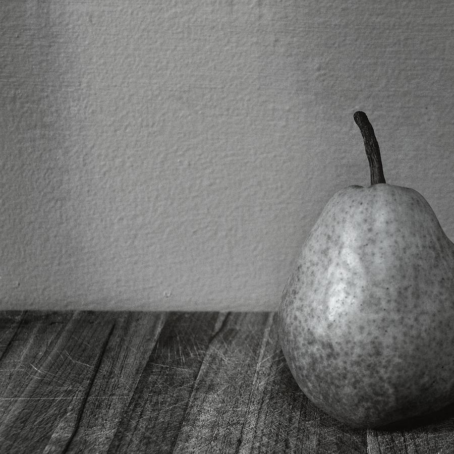 Pear with Grey Wall Photograph by Michelle Calkins
