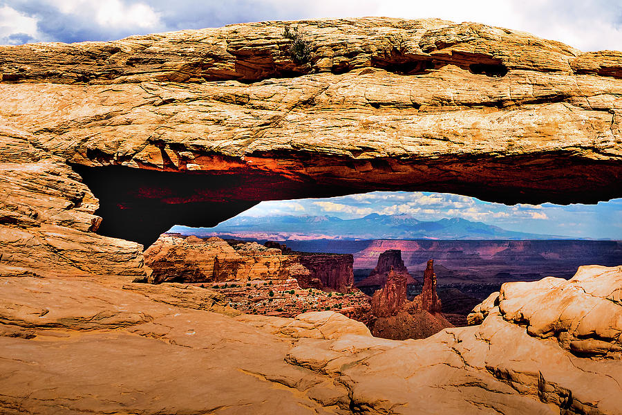 Peeking Through The Mesa Arch Photograph by Paul LeSage