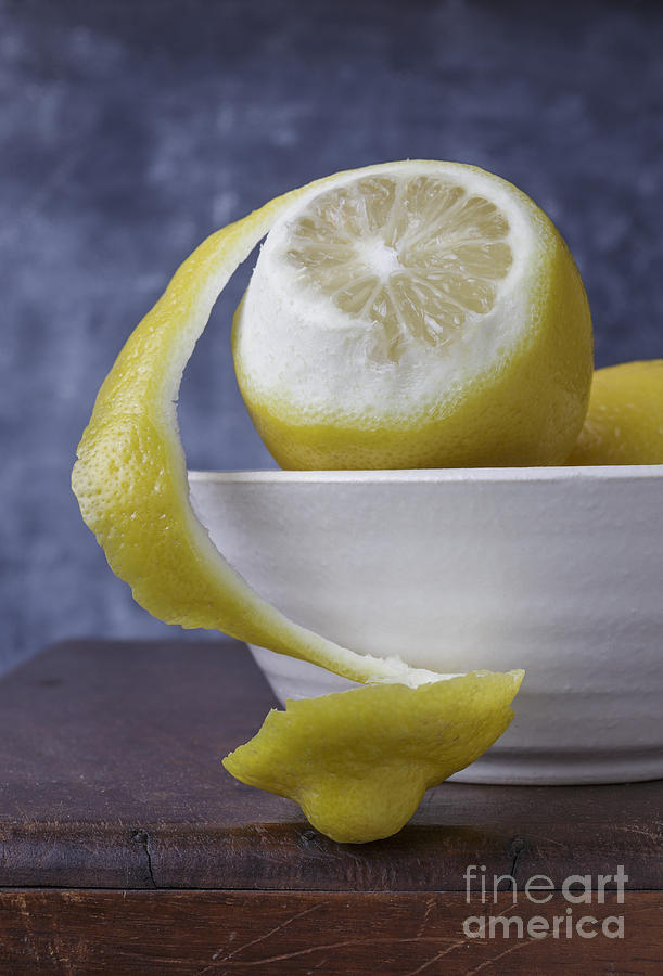Peeled Lemon in bowl Photograph by Edward Fielding