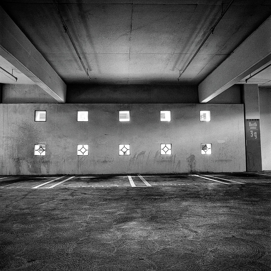 Peep Holes Wall In Parking Structure Photograph