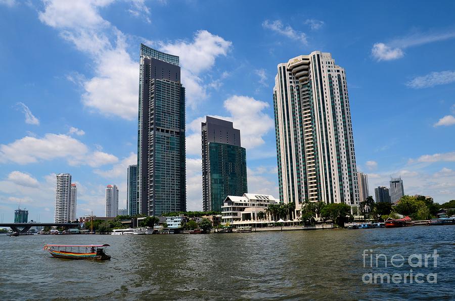 Skyscraper Photograph - Peninsula Hotel skyscrapers and boat across Chao Phraya River Bangkok Thailand by Imran Ahmed