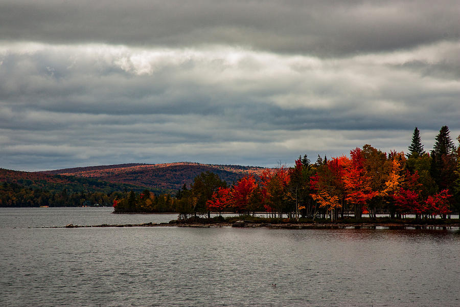 Peninsula of fall color on Rangeley Lake Photograph by Jeff Folger