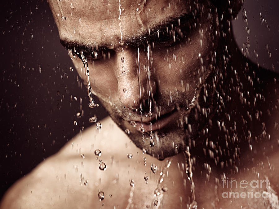 Pensive man face under showering water Photograph by Maxim Images Exquisite Prints