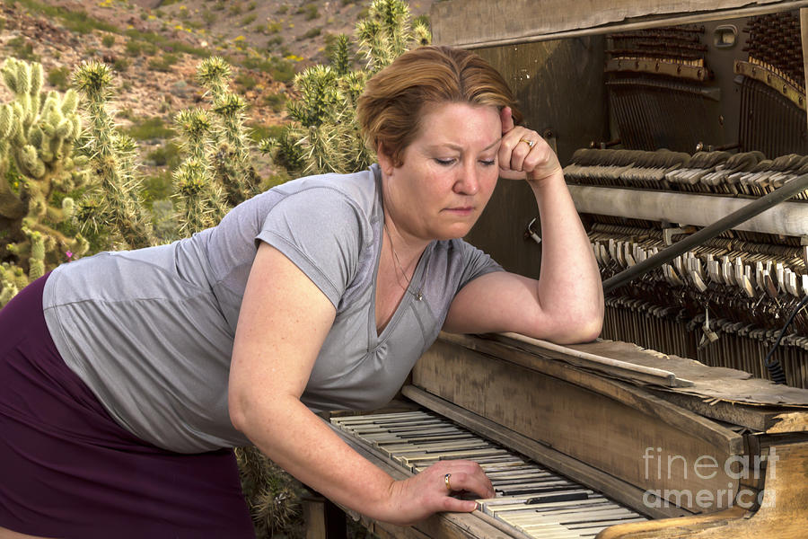 Pensive Woman Playing Antique Piano in Desert Photograph by Karen Foley